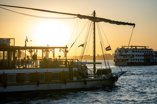 Traditional felucca sailing at sunset on the Nile, Kom Ombo, Egypt