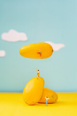 Creative Mango Fruit With Miniature Climbers Concept