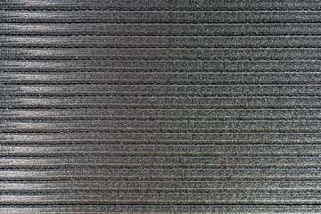 Background and texture of iron nails for a pneumatic nail gun, closeup, top view. Abstract surface of carpenters nails
