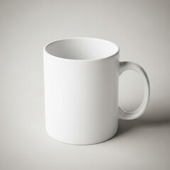 Obraz premium A simple mockup of a white ceramic mug on a plain, light gray background. A versatile, clean, and minimalist template for any logo, text, or print design.