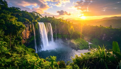 Cascading waterfall in lush, green landscape, illuminated by vibrant sunset light