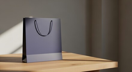 Elegant dark blue paper shopping bag on a wooden table in soft natural light
