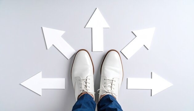 Businessman standing on arrows pointing in various directions, symbolizing decision and direction concept