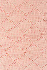 Fototapeta premium Sweater or scarf fabric texture large knitting. Knitted jersey background with a relief pattern. Wool hand- machine, handmade.