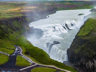 Aerial view shows Gullfoss in southwest Iceland as the Hvita River drops in two tiers into a rugged...