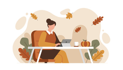 Autumn remote work concept Woman uses tablet at a desk surrounded by fall foliage and pumpkin decoration