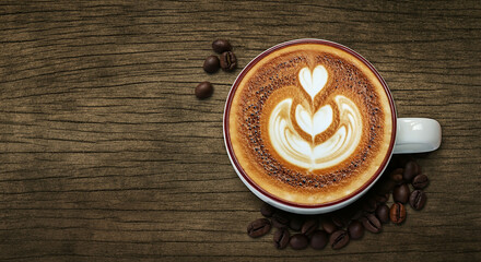 A table featuring a warm cup of coffee and some coffee beans, creating an inviting atmosphere for enjoyment