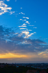 Morning Light Breaking Through City Clouds