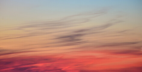 Stunning evening sky glowing in orange, pink, and blue hues.