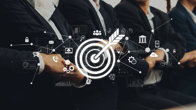 A professional business meeting showcases teamwork and ambition, featuring a digital interface that highlights goals and innovation for modern success. Raster - Powered by Adobe