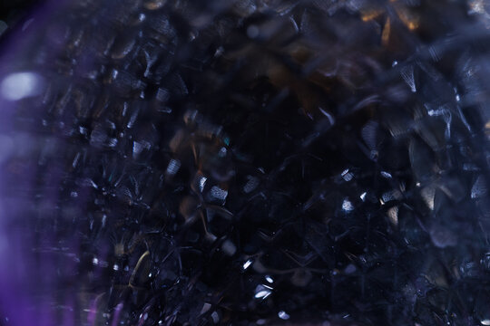 Easy to add lens flare effects for overlay designs or screen blending mode to make high-quality images. Abstract sun burst, digital flare, iridescent glare over black background. Defocused dark bokeh.