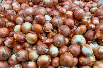 Onion in basket at grocery store, fruits and vegetables are sold at market