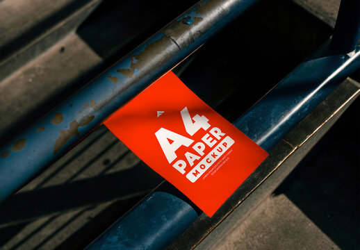 A4 Paper Tag Mockup with Grommet and String on Metal Industrial Surface