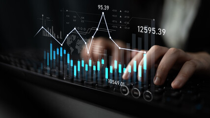 Close-up view of hands typing on a keyboard with digital graphs and data overlays highlighting financial trends and performance in a modern office setting. Scalp