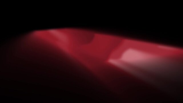 Abstract motion design featuring a red wave pattern with a glow effect on a dark background for a seamless loop animation