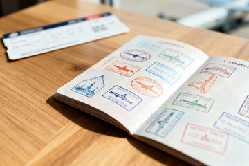 Passport With Travel Stamps and Ticket