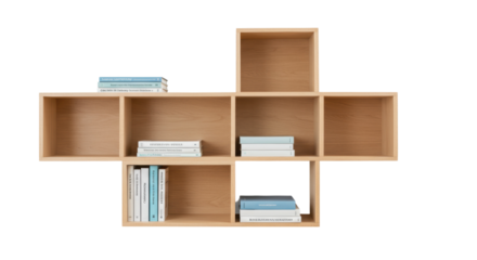 Modern light wood cube shelving unit isolated, contemporary bookcase with books for home decor and interior design projects