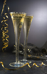 New Year concept, with bright light and champagne glass, abstract bokeh background