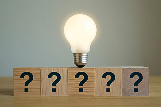 Question marks and light bulb concept for problem solving innovation and creative idea generation concept