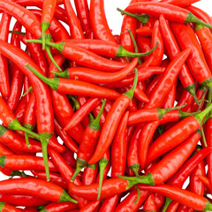 A vibrant pile of bright red, elongated chili peppers