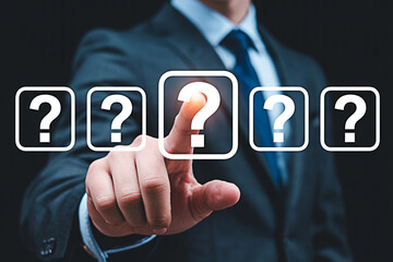 Businessman pointing at question mark icon business strategy decision making and problem solving concept