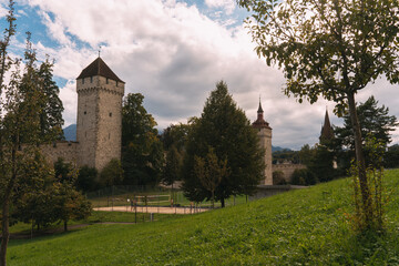 Musegg wall historic towers overlooking lucerne park with volleyball court