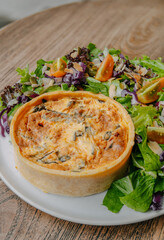 la Quiche Grandma with a French recipe with salmon, beef, and salad