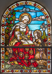 BAD REICHENHALL, GERMANY - SEPTEMBER 8, 2025: The St. Ann in the stained glass  in the church St. Johannes Spitalkirche by Mayer&rsquo;schen Hofkunstanstalt