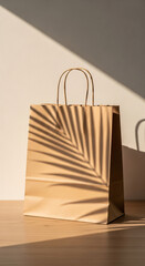 A single brown paper shopping bag casting the elegant shadow of a tropical palm leaf, evoking themes of sustainable consumption and natural product packaging