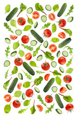 Bright summer salad ingredients of green vegetables, tomatoes and leafy greens as pattern, isolated. Fresh green cucumbers, bright sweet cherry tomato with colorful chard, spinach, arugula leaves.