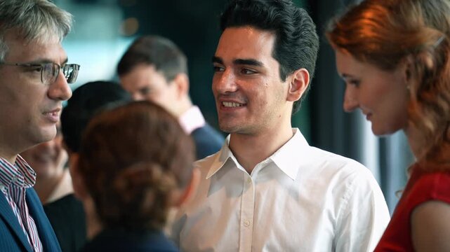Businessman enjoy discussing with business partner at corporate networking event or office New year party. Company meeting, Team collaboration, Employee and customer gathering