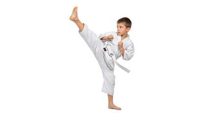 Young boy demonstrating a karate kick with precision and focus, wearing a white uniform and white belt, against a plain background.