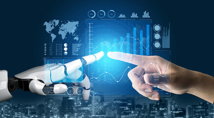 A striking image showing a robot hand and a human hand reaching out in a cybernetic interaction,...