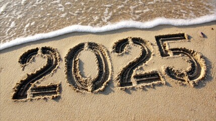 Fototapeta premium Digits Written in Sand by the Ocean Shoreline, Capturing the Year 2025 During a Sunny Day