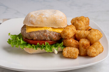 sweet italian sausage burger with tater tots