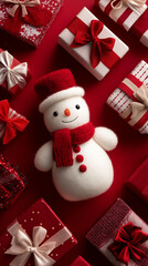 A cute little snowman among the gift boxes on the red background