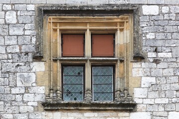 Facade and window in the village of Monpazier in France	