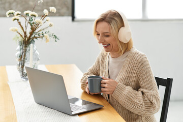 Fototapeta premium Blonde woman enjoys cozy moments at home in a modern apartment