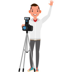 Smiling young man wearing a white jacket and grey pants holding a camera on a tripod waving hello with a white background