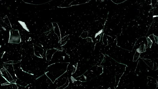 Super Slow Motion Shot of Real Glass Break at 1000 fps Isolated on Black Background.