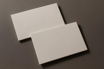 Mockup of business cards with raised print texture and shadow play