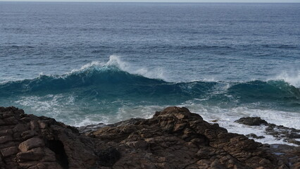 ocean and its power crashing against the cliffs