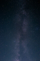 Fototapeta premium A bright Milky Way stretches across the clear summer night sky