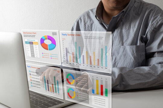Businessman analyzing financial data on a futuristic virtual interface. Business intelligence (BI) dashboard with charts and graphs for corporate strategy and big data analytics.