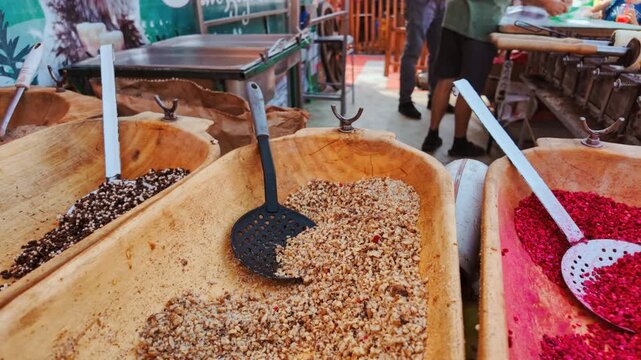 Chimney cakes, also known as kurtoskalacs or kurtos, being roasted in a traditional coal cake oven