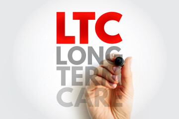 LTC Long Term Care text concept. Red acronym with gray supporting words, written by a hand holding a marker on light background, representing medical and health care assistance