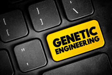 Naklejka premium Genetic Engineering - process that uses laboratory-based technologies to alter the DNA makeup of an organism, text button on keyboard, concept background