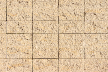 Beige stone wall building exterior texture background