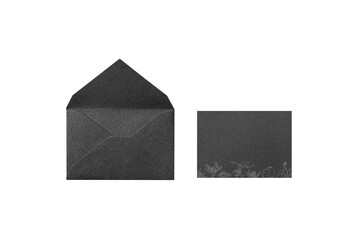 Overhead shot of a black card with a line-drawn flower illustration, placed next to the opened back side of a black envelope
