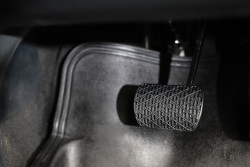 The driver checks the car's brakes every time before a long journey for safety.